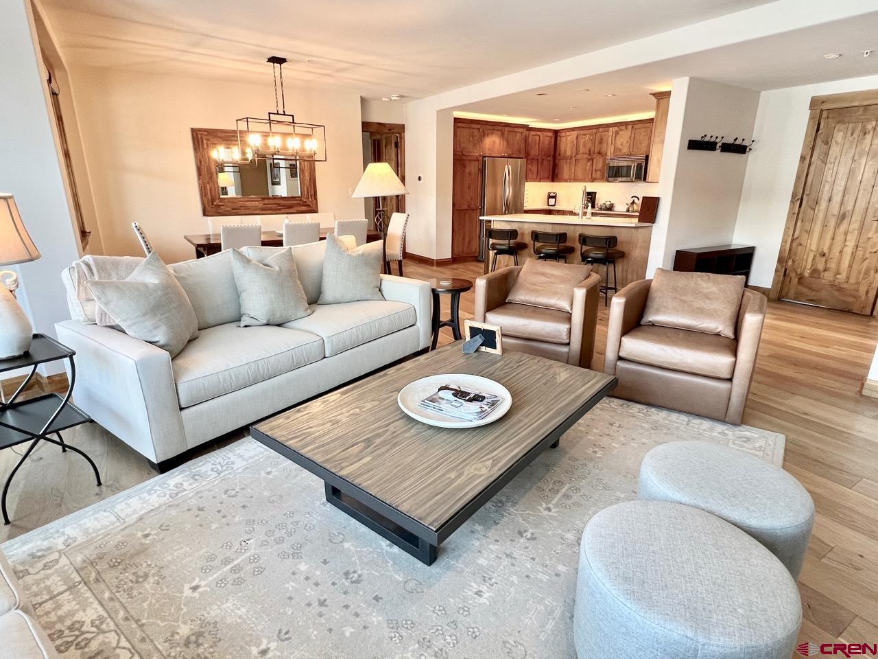 14 Hunter Hill Road, Unit C203 Crested Butte, CO 81225 - Photo 6 of 34 a living room with furniture and wooden floor