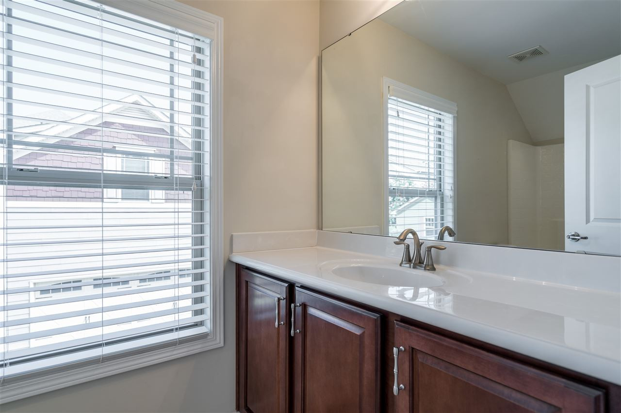 5630 Wade Park Boulevard Raleigh, NC 27607 - Photo 27 of 30 Full bathroom in garage suite. Tub/shower combo, coordinating cabinets with the house and all you could need! Bathroom