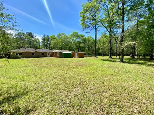 a swimming pool with an outdoor space and seating area