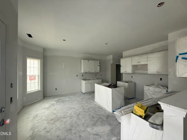 a view of kitchen and windows