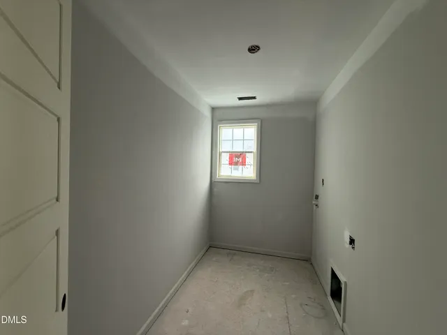 a view of an empty room and a window