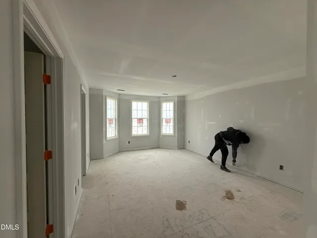 a view of a livingroom with a table and a window
