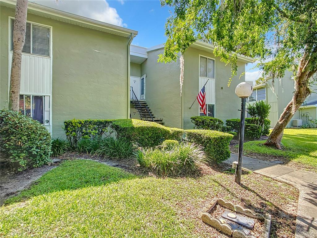 588 Bahia Circle, Unit A Ocala, FL 34472 - Photo 1 of 1 a front view of a house with garden