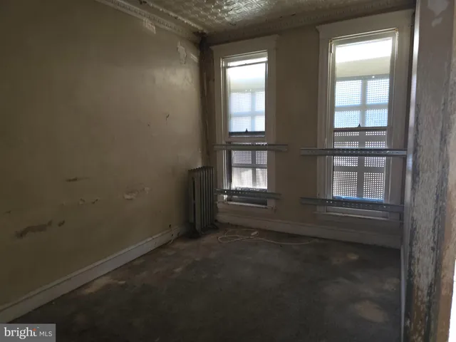 an empty room with windows