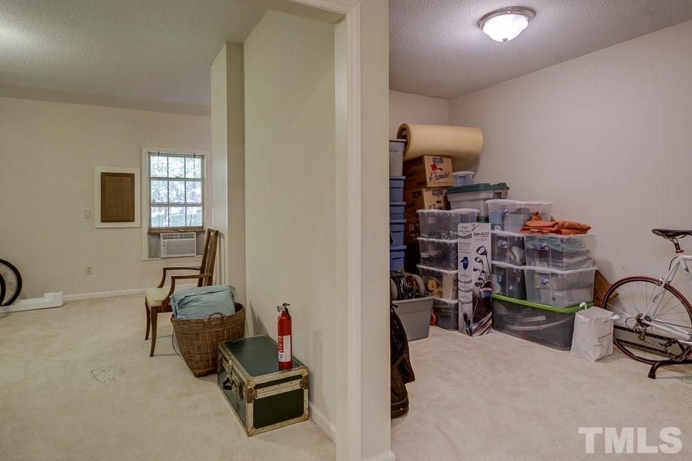 102 Timber Ridge Drive Durham, NC 27713 - Photo 17 of 25 Part of the Bonus Room on the left, Family Room on the right. Many areas on the lower level are currently being used for packing & storage as Seller prepares to move.