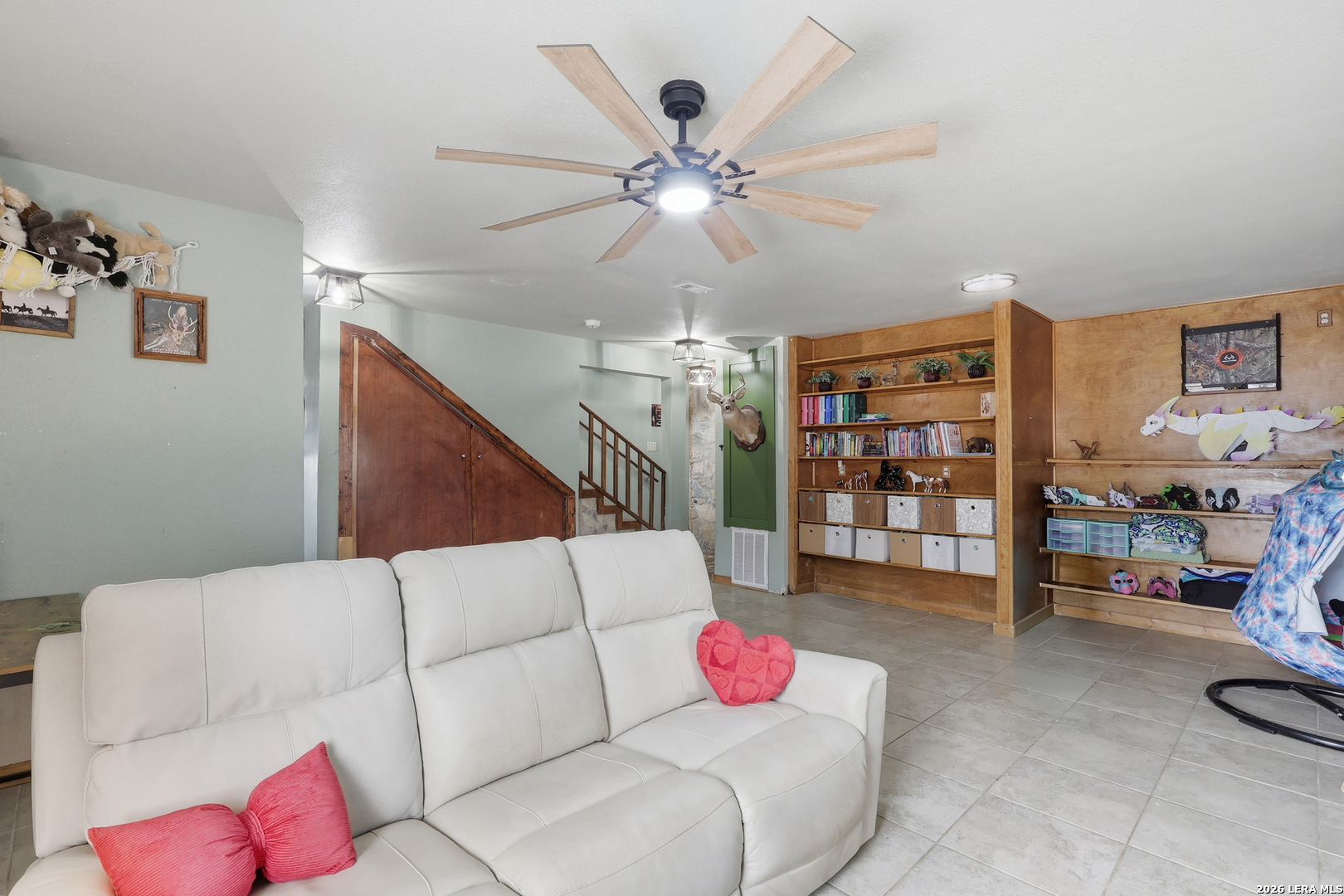 31910 Blanco Road Bulverde, TX 78163 - Photo 11 of 25 a living room with furniture and a ceiling fan