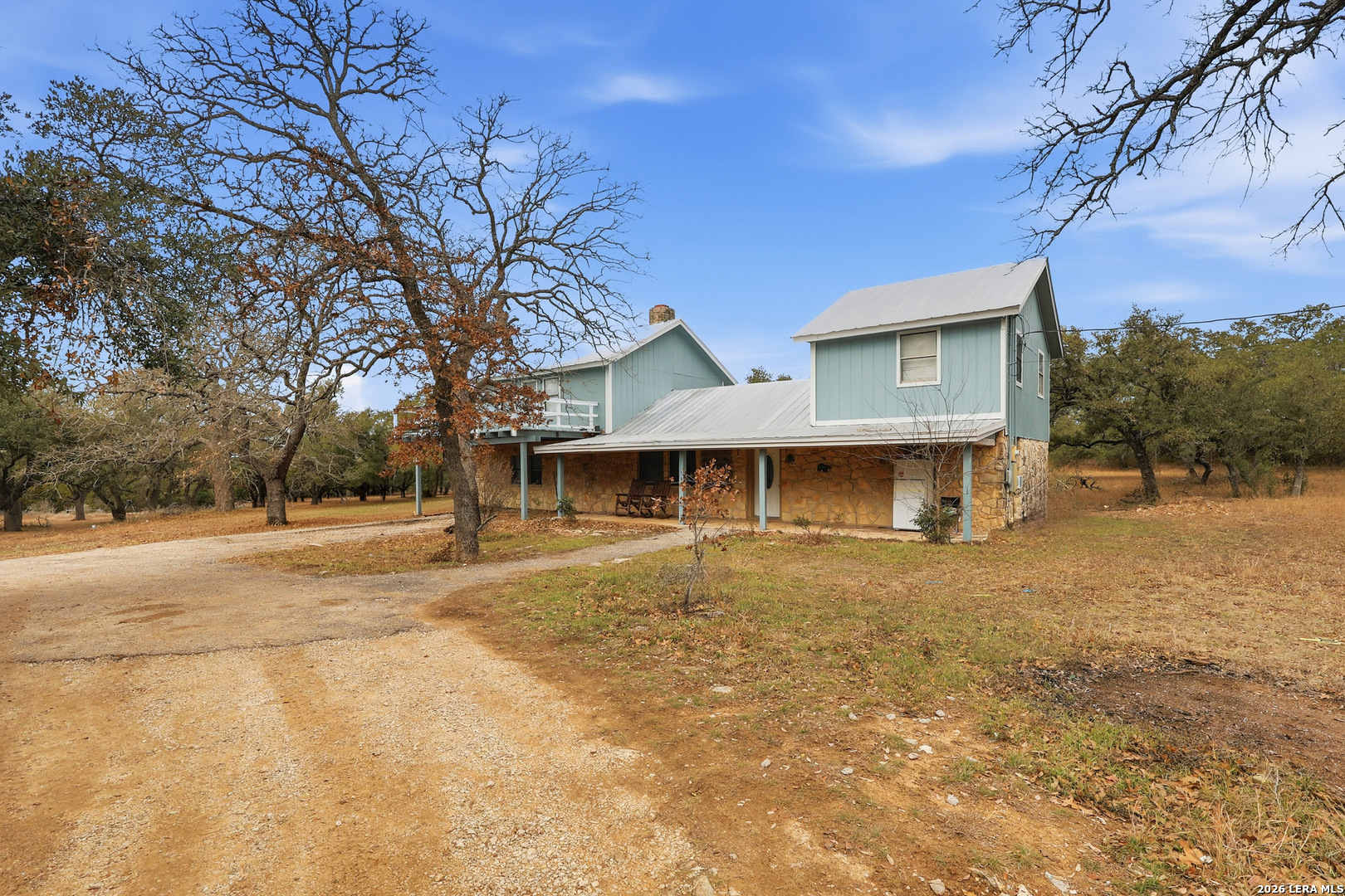31910 Blanco Road Bulverde, TX 78163 - Photo 3 of 25 a front view of a house with yard and garage