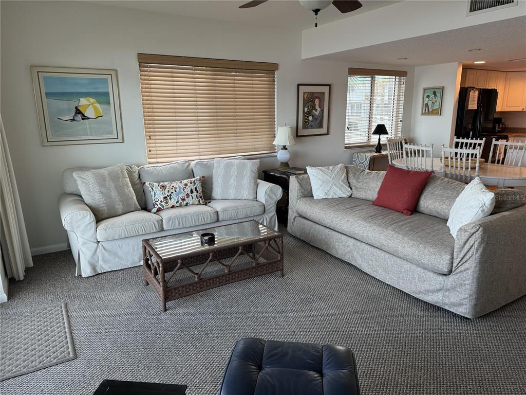 815 Ocean Shore Boulevard, Unit 13A Ormond Beach, FL 32176 - Photo 11 of 11 a living room with furniture and a large window