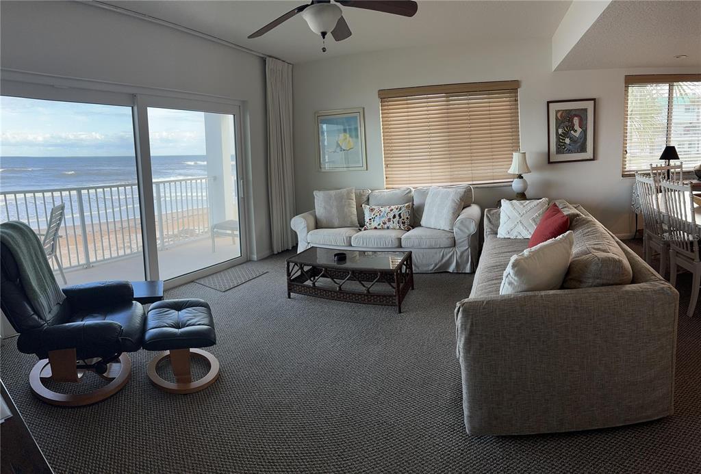 815 Ocean Shore Boulevard, Unit 13A Ormond Beach, FL 32176 - Photo 2 of 11 a living room with furniture and a window
