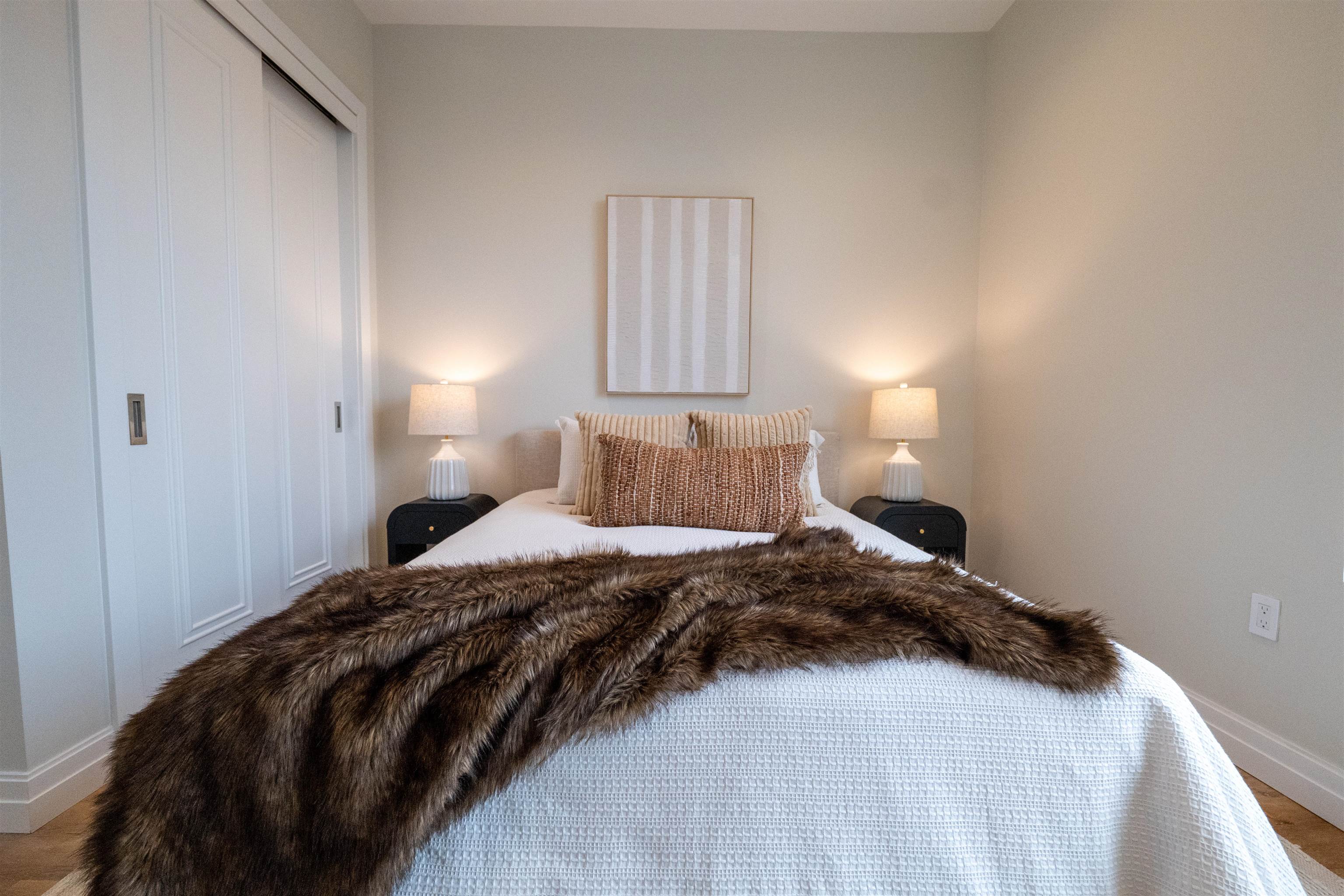 1722 Springfield Avenue, Unit 403 Maplewood, NJ 07040 - Photo 13 of 31 a bedroom with a bed and a window