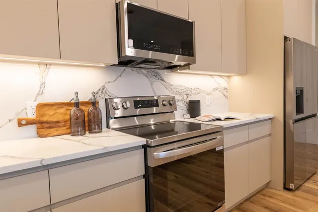 a kitchen with a stove and a microwave