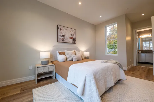 a bedroom with a bed and a couch