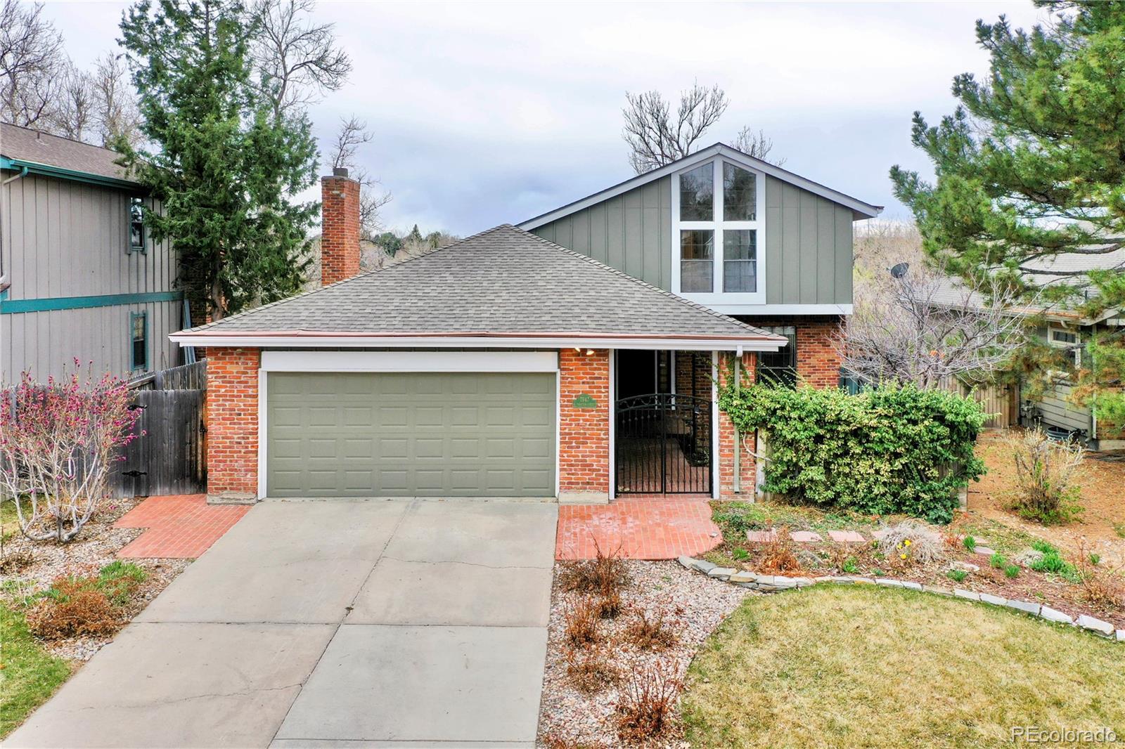 7947 South Trenton Street Centennial, CO 80112 - Photo 1 of 35 a front view of a house with yard and tress