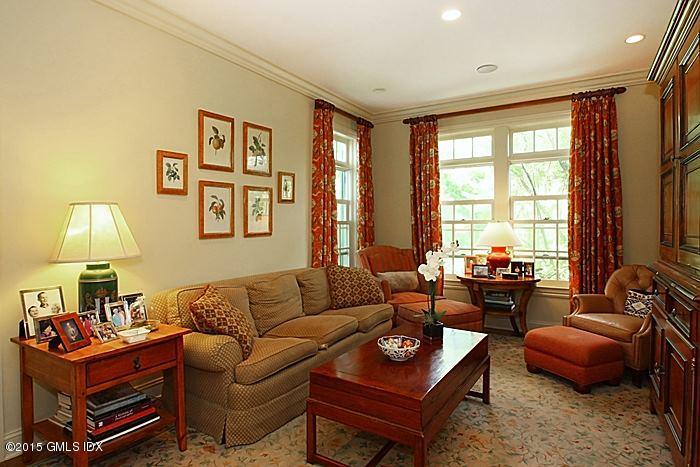 25 Ridgeway Greenwich, CT 06831 - Photo 12 of 25 a living room with furniture a large window and a flat screen tv