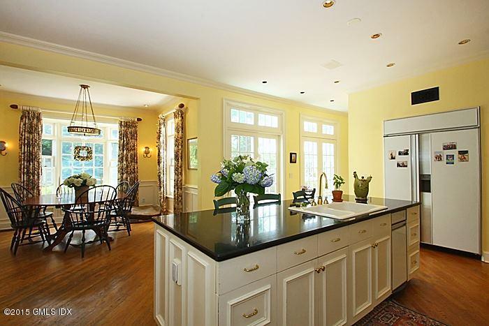 25 Ridgeway Greenwich, CT 06831 - Photo 13 of 25 a kitchen with center island table and chairs