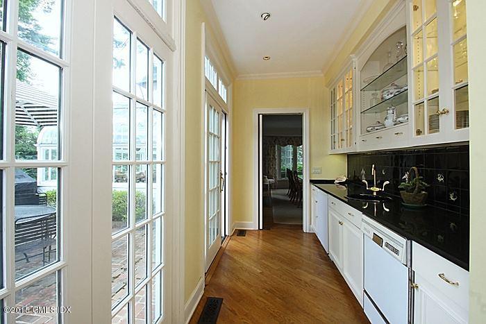 25 Ridgeway Greenwich, CT 06831 - Photo 17 of 25 a large white kitchen with stainless steel appliances granite countertop a stove and a sink