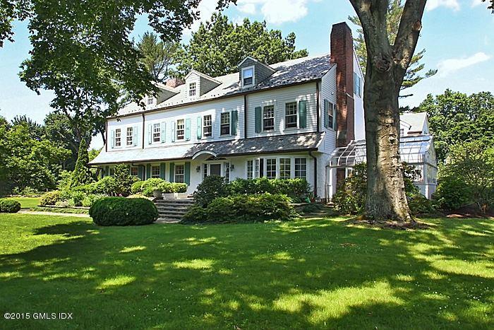 25 Ridgeway Greenwich, CT 06831 - Photo 2 of 25 a front view of a house with a garden and plants
