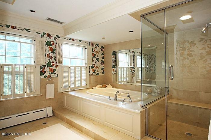 25 Ridgeway Greenwich, CT 06831 - Photo 22 of 25 a bathroom with a tub sink shower and mirror