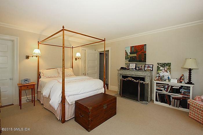 25 Ridgeway Greenwich, CT 06831 - Photo 23 of 25 a bedroom with a bed and a flat screen tv