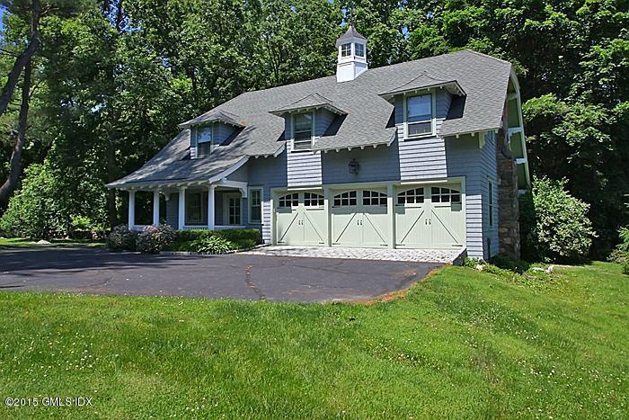 25 Ridgeway Greenwich, CT 06831 - Photo 3 of 25 a view of a yard in front of a house with plants and large tree