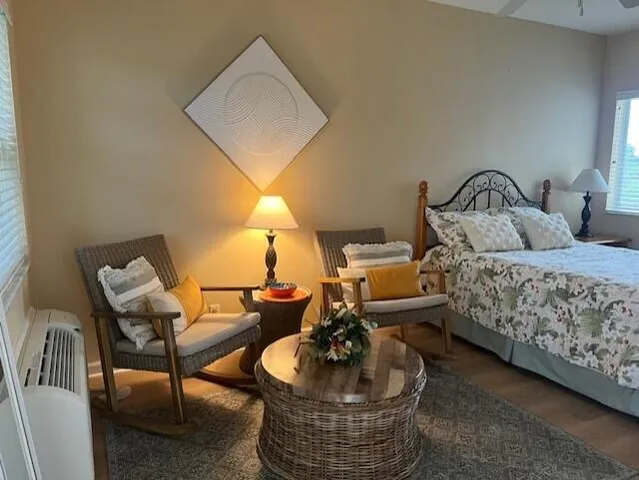 a living room with furniture and a lamp