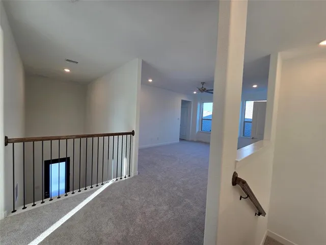 a view of hallway with stairs