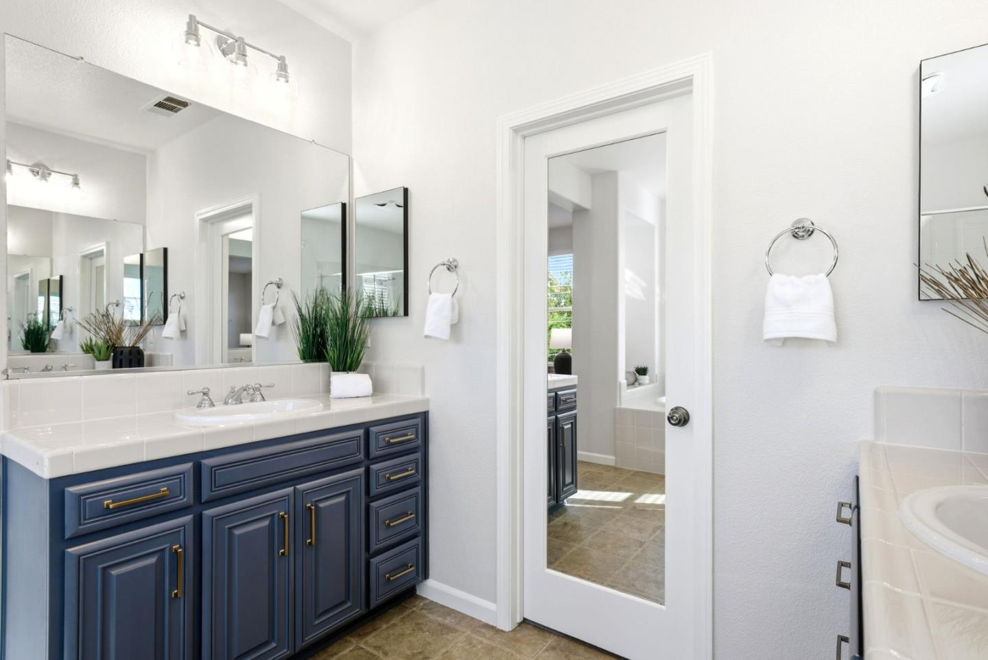 2556 Harlow Lane San Ramon, CA 94582 - Photo 36 of 62 a bathroom with a shower sink and mirror
