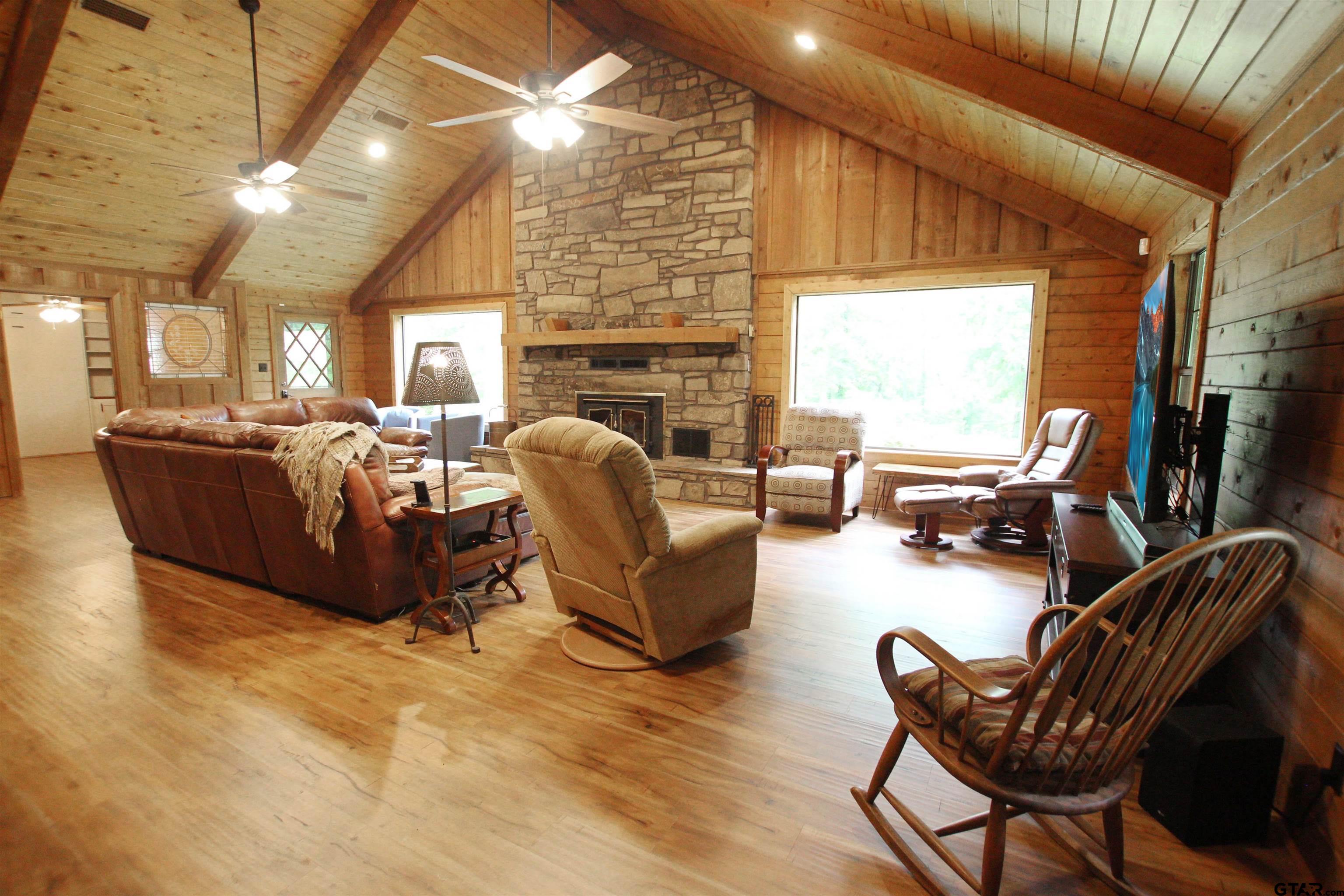 782 Rosie Wady Road Gladewater, TX 75647 - Photo 4 of 48 a living room with furniture fireplace and a flat screen tv