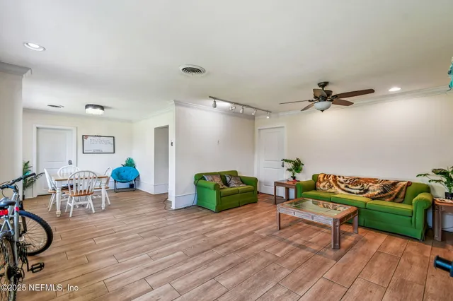 a living room with furniture a window and a table