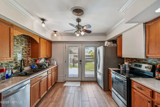 a kitchen with a sink cabinets and window