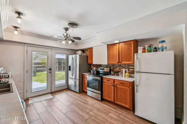 a kitchen with sink cabinets and window