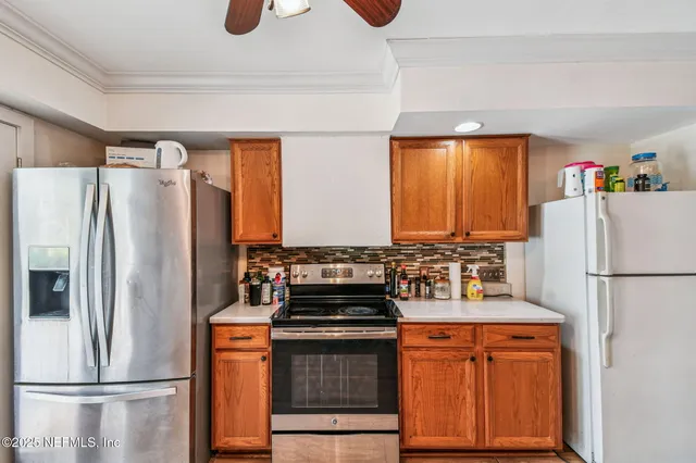 a view of a livingroom with furniture and gym equipment