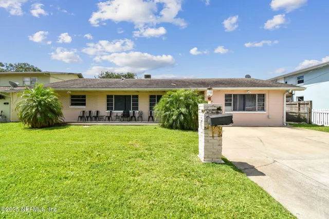 a view of house with yard