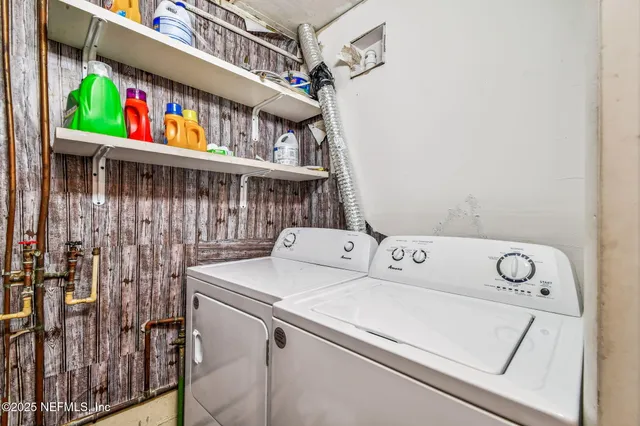 a living room with furniture a rug and a window