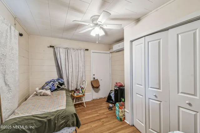 a bedroom with a bed and a table