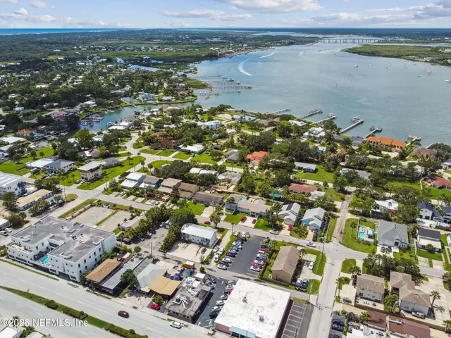 an aerial view of a house with a garden and plants