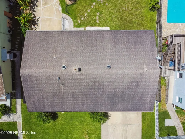 an aerial view of a house with a garden