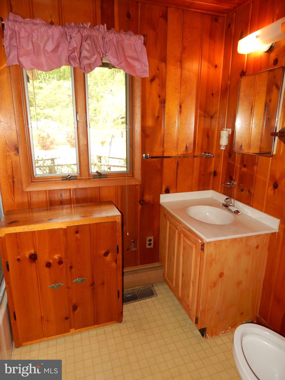4020 Dahlia Road Port Republic, MD 20676 - Photo 13 of 23 a bathroom with a sink a toilet and a tub