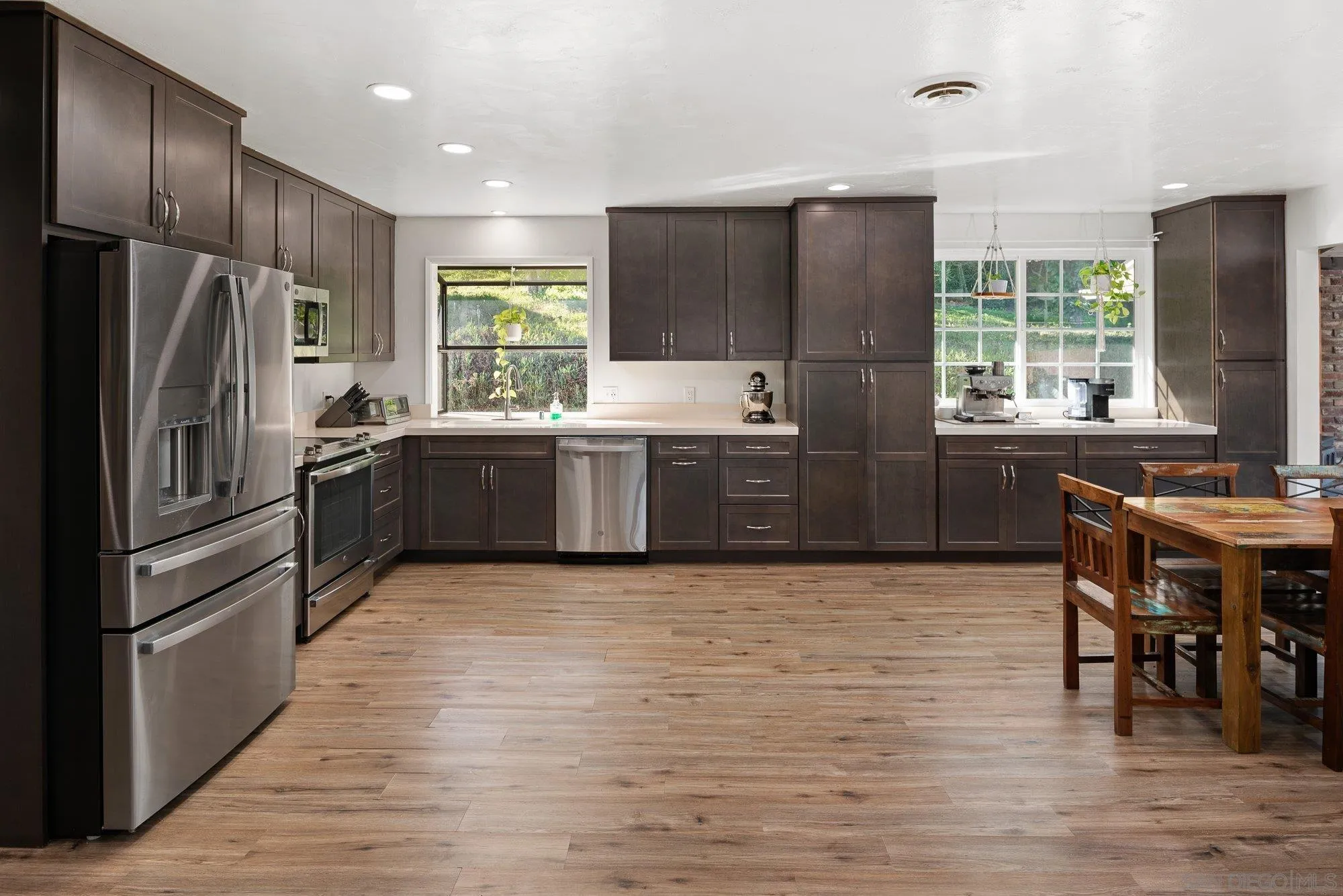 1780 Grove Road El Cajon, CA 92020 - Photo 12 of 59 a kitchen with stainless steel appliances granite countertop a refrigerator and a stove top oven