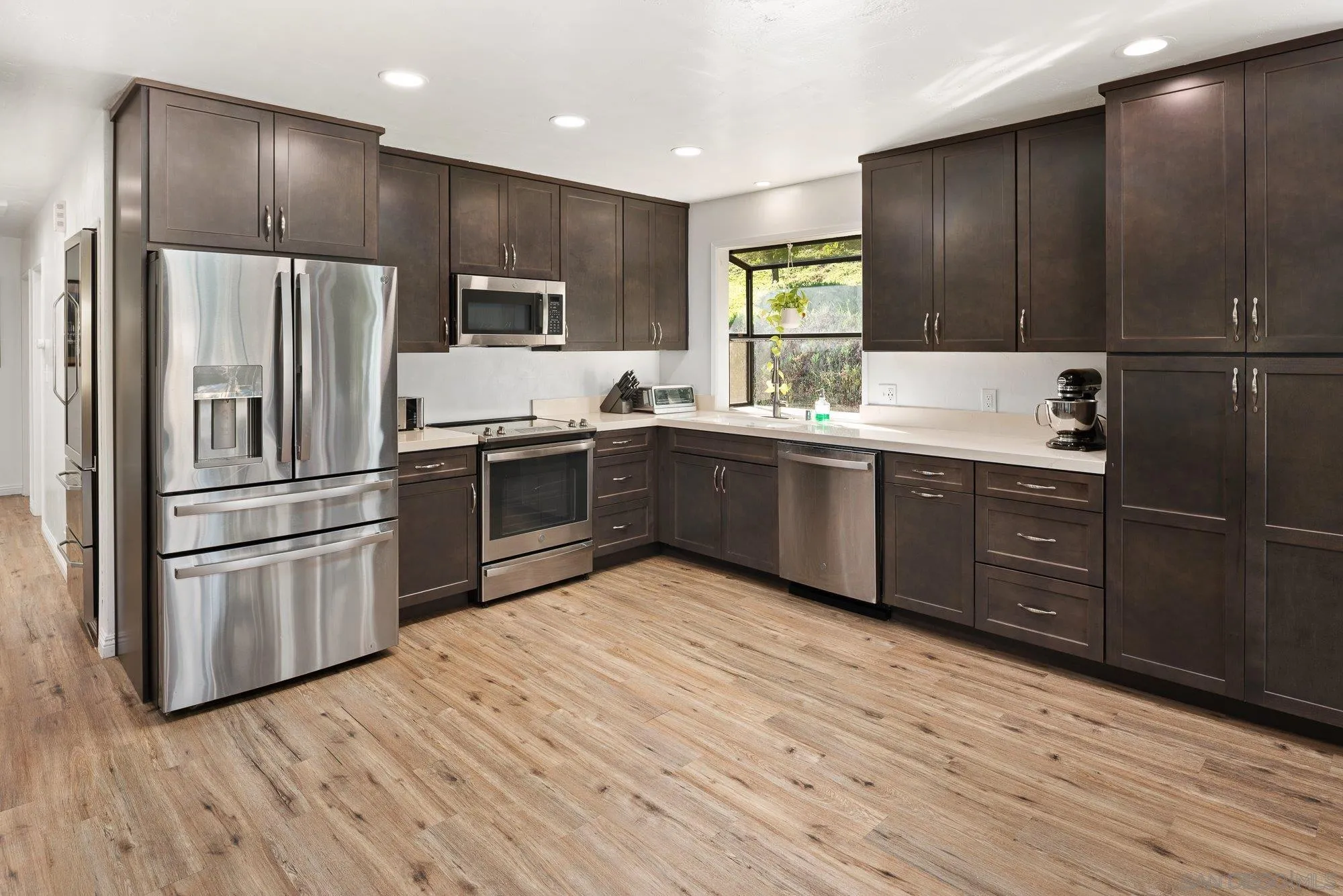 1780 Grove Road El Cajon, CA 92020 - Photo 14 of 59 a kitchen with stainless steel appliances granite countertop a refrigerator and a sink