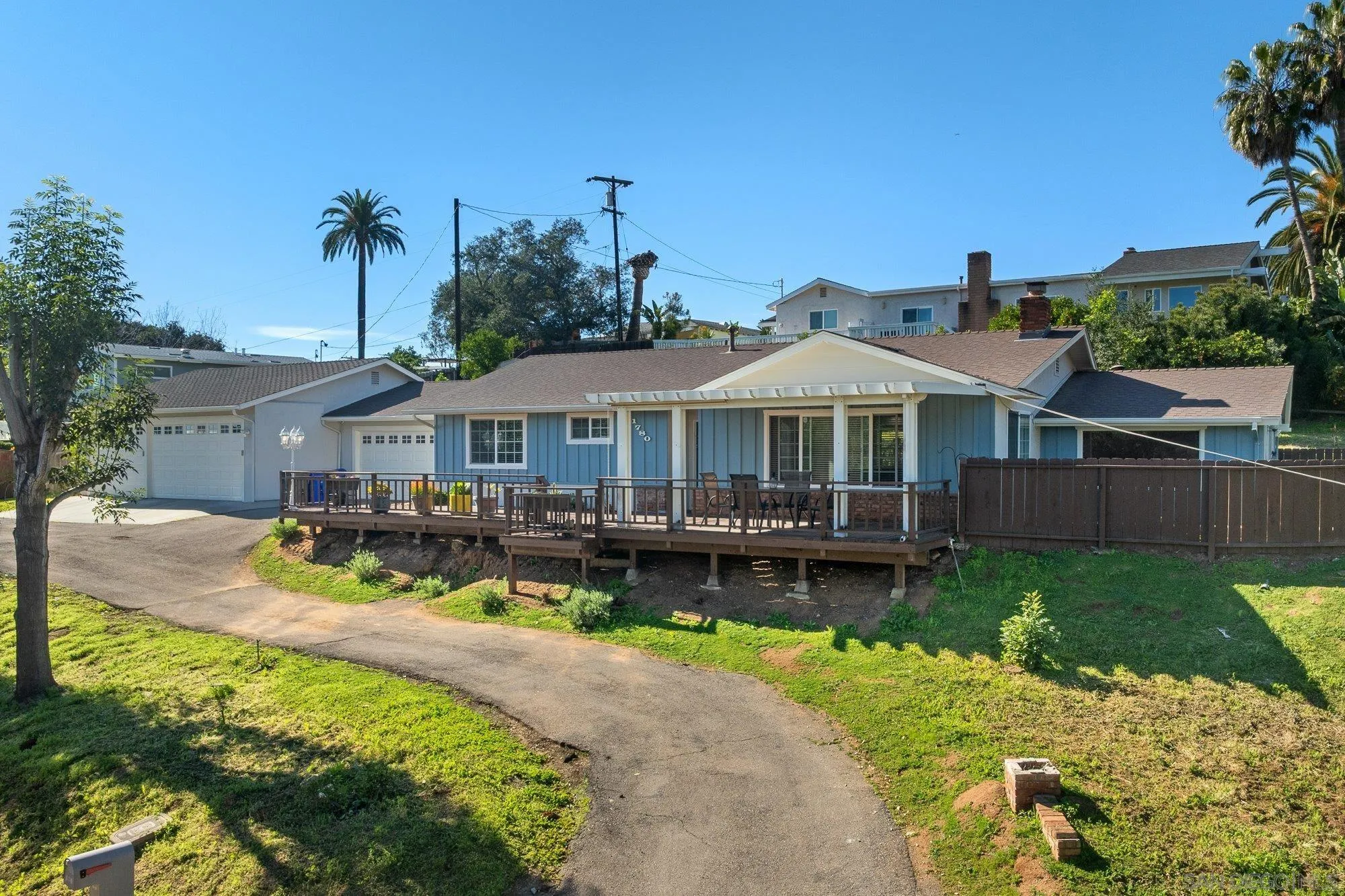 1780 Grove Road El Cajon, CA 92020 - Photo 2 of 59 a front view of a house with swimming pool having outdoor seating