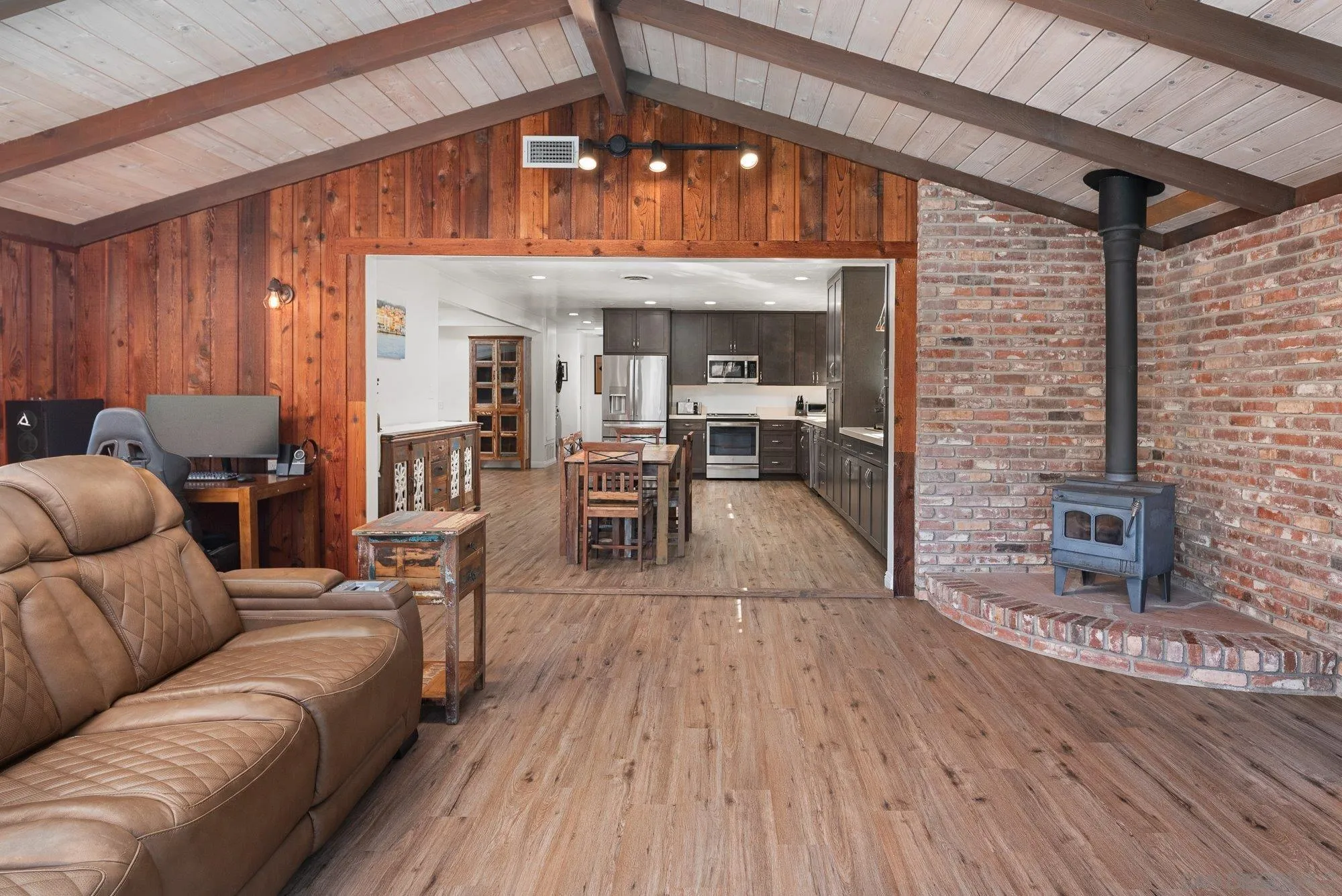 1780 Grove Road El Cajon, CA 92020 - Photo 21 of 59 a living room with furniture a wooden floor and a fireplace