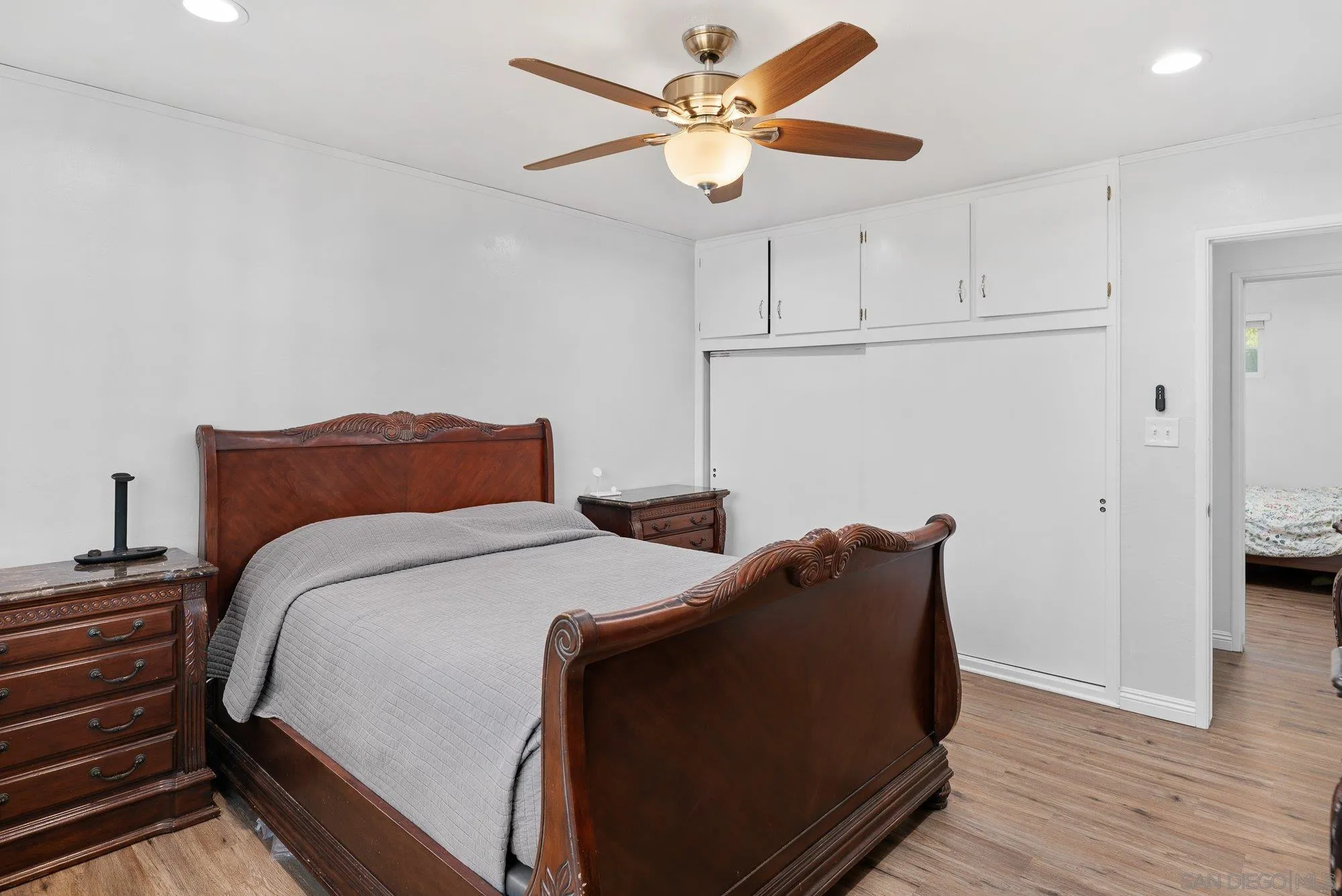 1780 Grove Road El Cajon, CA 92020 - Photo 24 of 59 a bedroom with bed and wooden floor