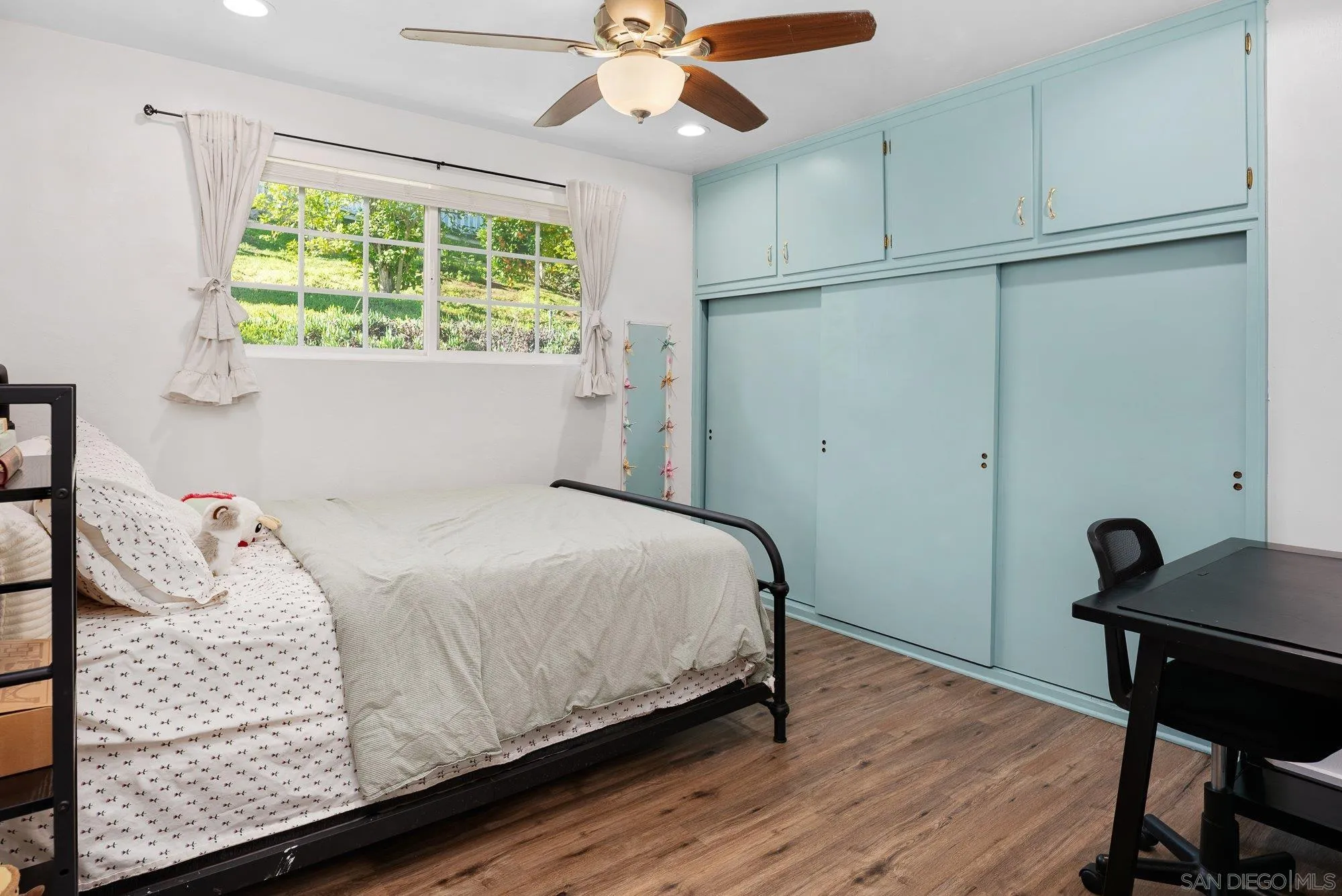 1780 Grove Road El Cajon, CA 92020 - Photo 26 of 59 a bedroom with a bed and a window