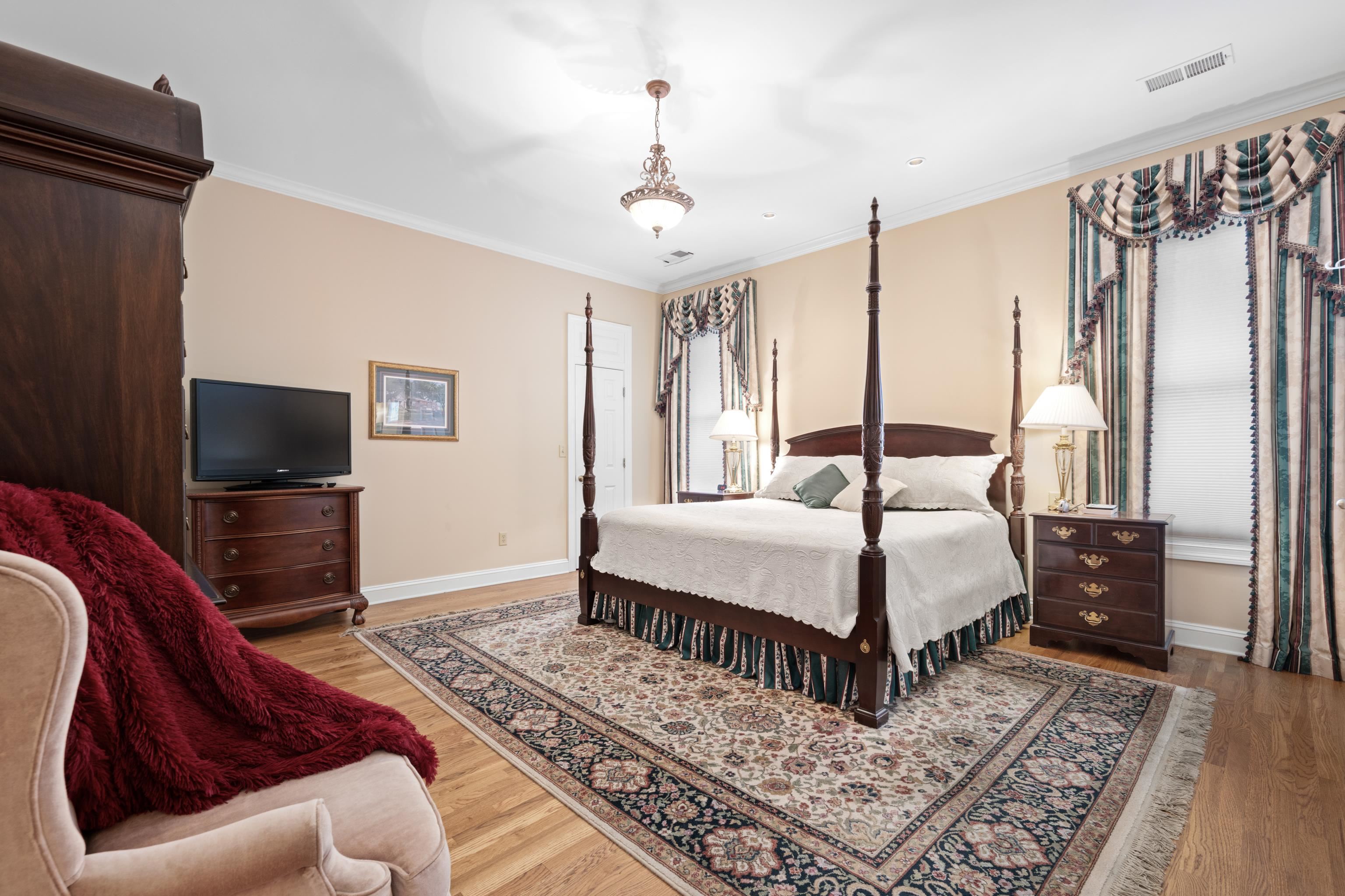 192 North White Station Road Memphis, TN 38117 - Photo 11 of 40 a bedroom with a bed a flat screen tv and a couch