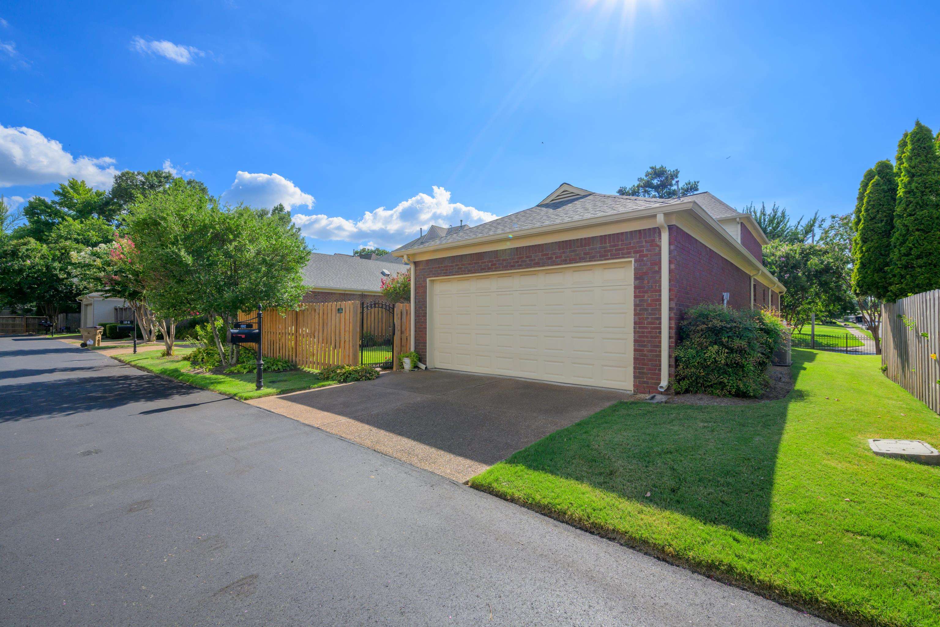 192 North White Station Road Memphis, TN 38117 - Photo 38 of 40 a front view of a house with a yard and garage