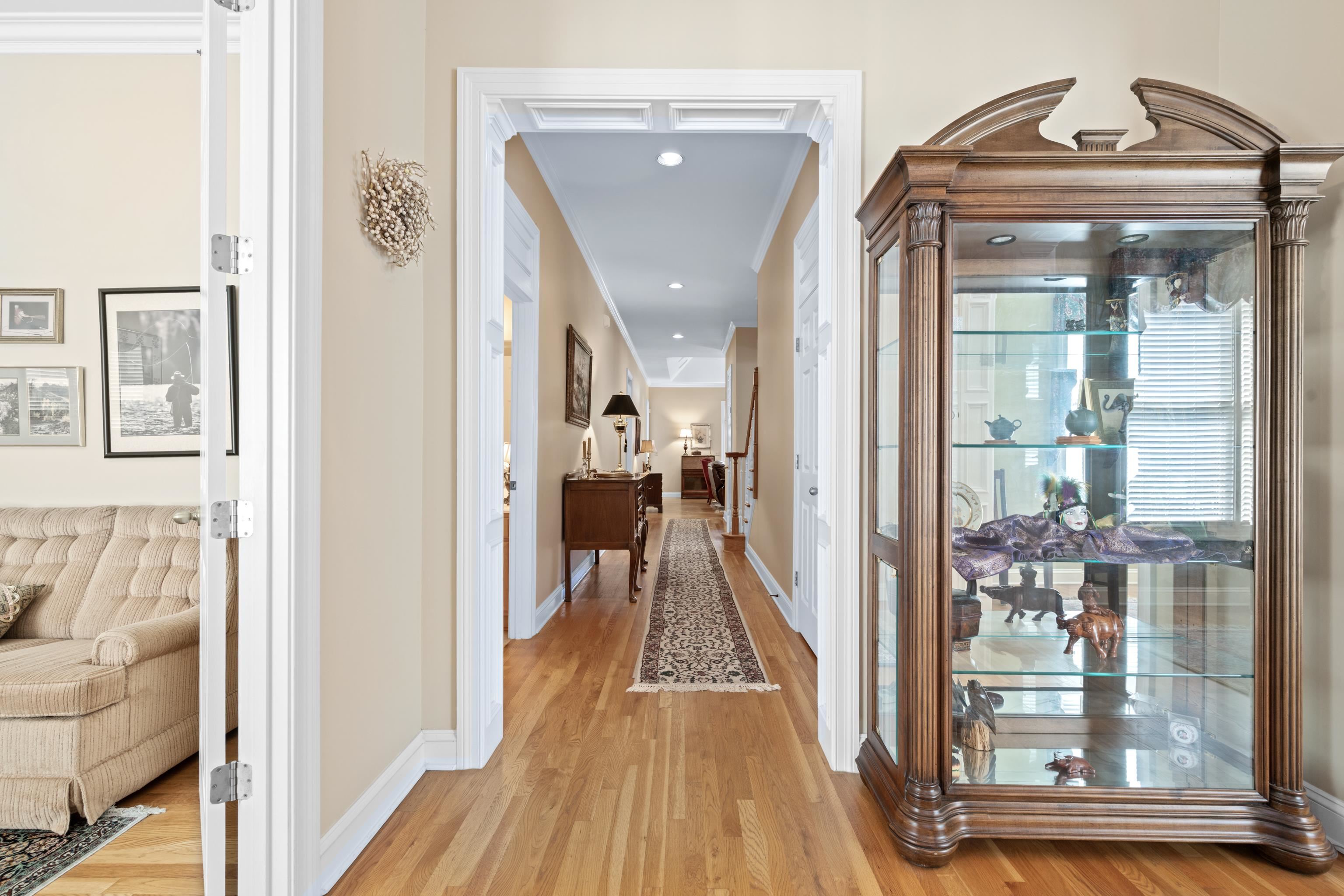 192 North White Station Road Memphis, TN 38117 - Photo 5 of 40 a view of a hallway with wooden floor and staircase