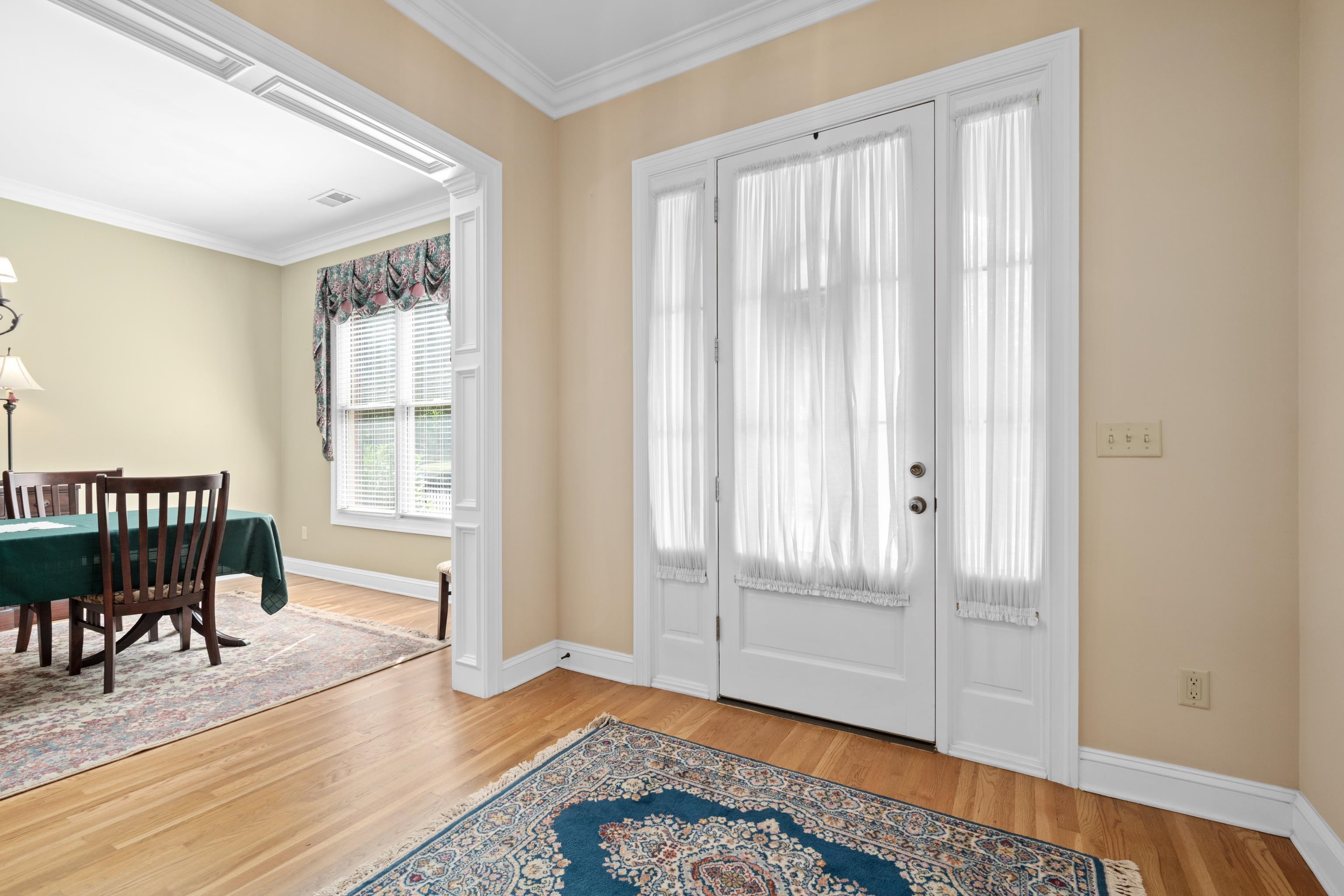 192 North White Station Road Memphis, TN 38117 - Photo 6 of 40 a view of a room with wooden floor lounge chair and windows