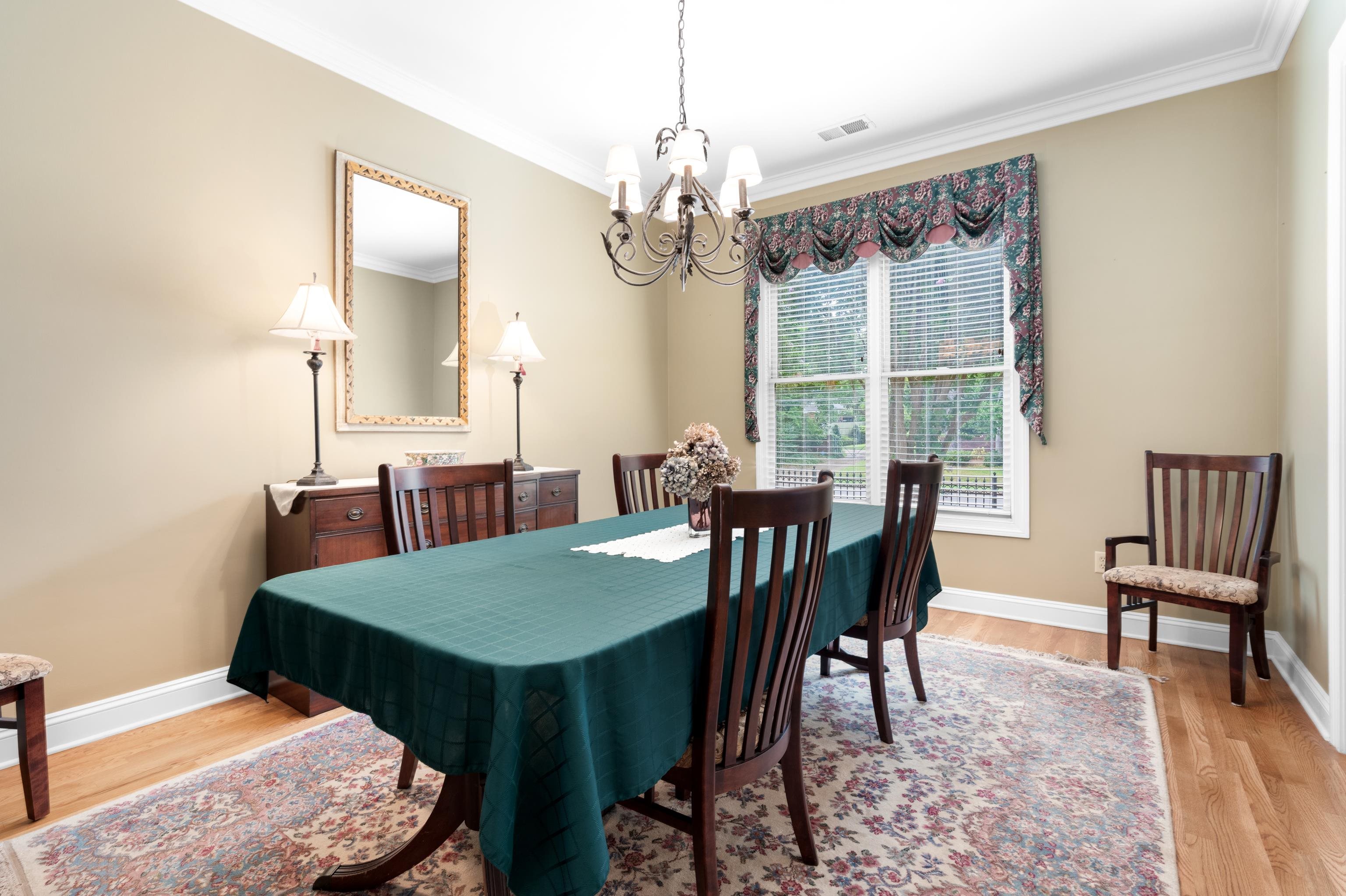192 North White Station Road Memphis, TN 38117 - Photo 9 of 40 a view of a dining room with furniture window and wooden floor