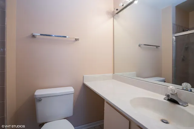 a bathroom with a sink toilet and vanity